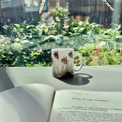 Albrecht Dürer ceramic mug filled with coffee on a desk, featuring detailed Young Hare and Piece of Turf artwork, museum-quality gift for art lovers